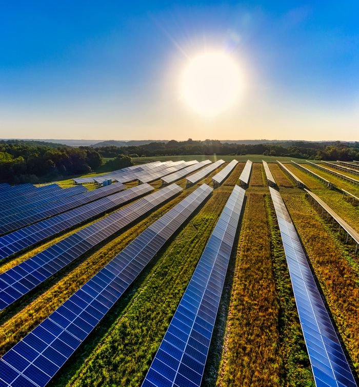 Aerial view of a solar farm in Red Wing, MN, with solar panels harnessing the sun's energy.